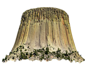 Striking vertical rock formations create a unique landscape, topped with textured rock and accented by green vegetation