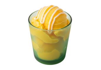 A vibrant yellow mango sorbet is served in a frosted green glass, topped with white sauce swirls.
