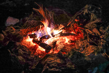 Close-up of crackling fire flames under the night sky