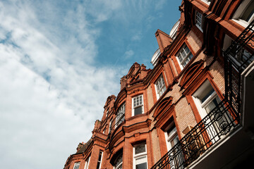 London red brick victorian architecture building under blue sky
