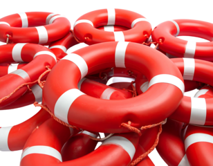 Red lifebuoys piled randomly atop each other, with white stripes and a black backdrop for a simple yet strong visual