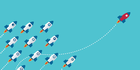 One red rocket ship leads a fleet of white rockets on a blue background representing innovation and success