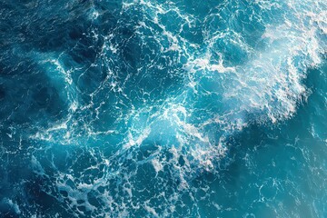 Aerial View of Turquoise Ocean Water with White Frothy Waves and Sea Foam Glittering Under Bright Sunlight Creating Dynamic Patterns and Textures