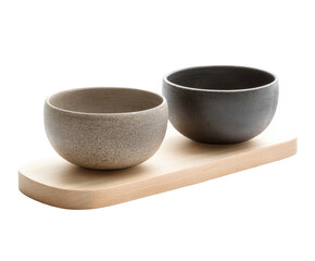 Two ceramic bowls on a wooden tray, neutral tones against a dark backdrop