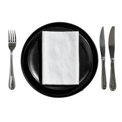 Elegant place setting black plate, white napkin, silver flatware