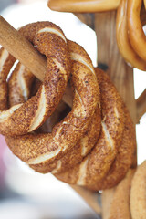 Freshly baked turkish simit hanging at a local market