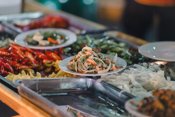 Stir-fried food, being served on a plate, being served on a plate