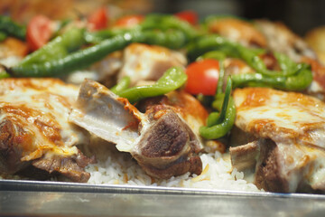 Grilled chicken with rice and veggies served