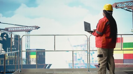 Offshore engineer using laptop to analyze subsea mapping data, evaluating drilling sites. Worker looks at world map overlay with ocean oil resource exploration zones, assessing topology, camera A - Powered by Adobe