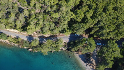 Aerial view of lush forests meeting the ocean, showcasing the beauty of nature from above. Perfect for landscape, travel, and nature photography.