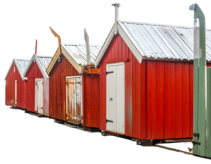 Row of red wooden cabins with white doors, each with a distinctive chimney, set against a black background