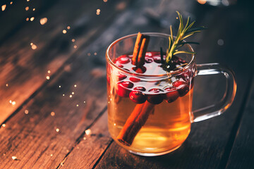 Hot Cranberry Cinnamon Drink with Rosemary in Glass Mug hot drink