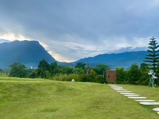 Green yard with mountain chiang dao located in Chiang mai northern part of Thailand