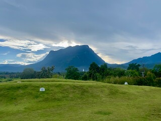 Green yard with mountain chiang dao located in Chiang mai northern part of Thailand