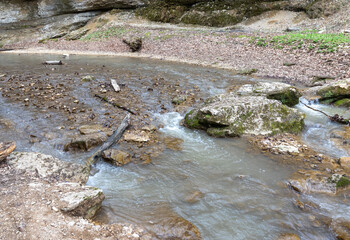 River canyon in spring on a sunny day, walking along the riverbank