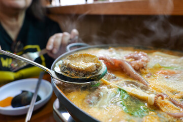 Seafood hotpot at a restaurant in Jeju Island.