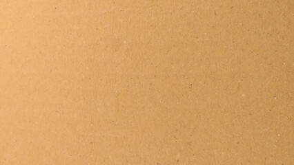 Brown paper texture background for presentation product. Pastel peach illumination, grainy color gradient background,