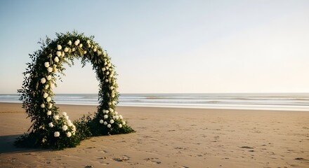 A beautiful floral wedding arch on a sandy beach, symbolizing love and a romantic seaside ceremony under a clear sky.