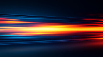 Abstract streaks of vibrant orange yellow and blue light blur across a dark background