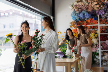 Women florists arranging flowers in floral shop