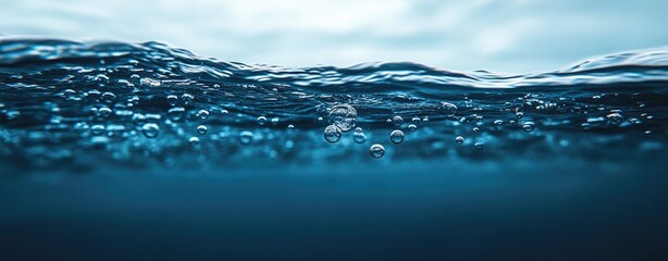 Deep blue water with bubbles near the surface