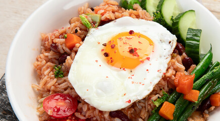 ndonesian nasi goreng (fried rice) served on a plate.