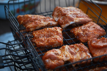 Marinated Pork Ribs Grilling Outdoors - Juicy Barbecue Close-Up