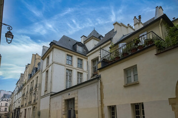 Paris, buildings in the Marais, in the center, in a typical street
