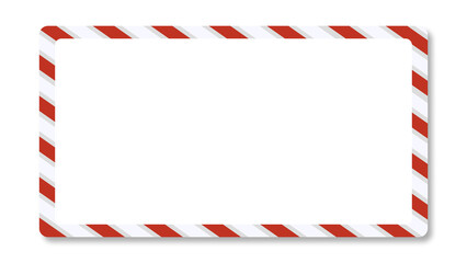 Obraz premium A rectangular frame or label template featuring a thick border designed with alternating red and white diagonal stripes, strongly resembling candy canes