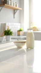 A well-lit, minimalist kitchen table with a bowl and milk bottle