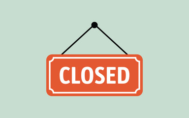 Orange closed sign hanging on a light green background