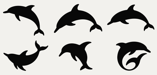 Naklejka premium Collection of silhouetted dolphins in various playful poses