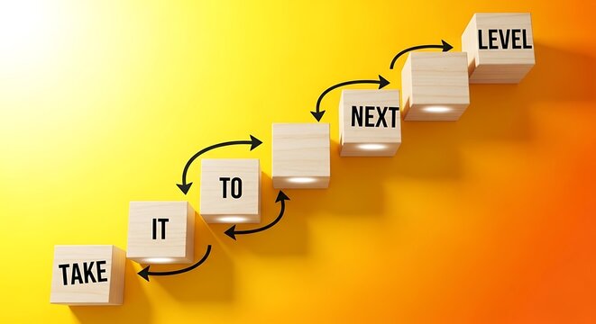 Wooden blocks spelling out take it to next level arranged in a staircase on a vibrant yelloworange gradient background