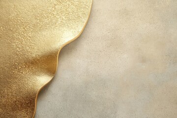 Sculpted gold edge with textured metallic finish on stone wall ideal for luxury branding premium mockups and product presentation
