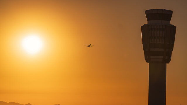 airplane taking off at sunset in PHX