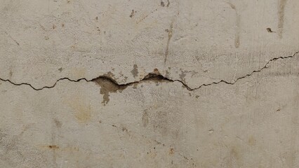 black and white image of a cracked wall. cracked white paint on a white background. old cracked texture, dry land crack texture for overlay, cracked wall texture grunge background. White black grey. 
