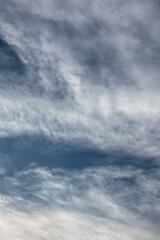 Obraz premium Wispy Clouds Against a Blue Sky