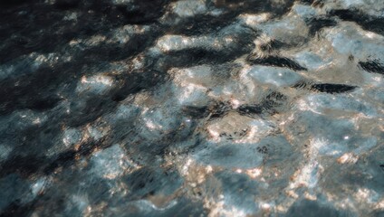 Abstract rippled water surface, reflecting light in shades of grey and silver