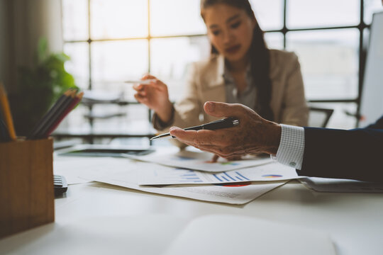 Business people discussing data during meeting