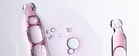 Skin serum in a pipette. A cosmetic product for body care. White background.