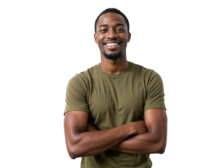 Smiling man stands confidently with arms crossed wearing a green shirt in a bright, neutral setting