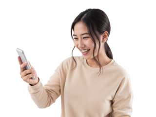 Woman smiles while using smartphone, enjoying a moment of connection indoors