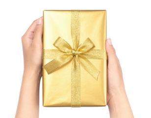 A pair of hands holds a beautifully wrapped golden gift box adorned with a shiny ribbon and bow.