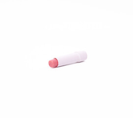 Pink lip balm stick for lip care and beauty on a crisp white background.