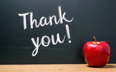 National Teacher Day, Thank you!  Annual USA holiday on Tuesday of 1st full week of May.  Chalk text on blackboard with red apple. High quality