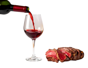 A glass of red wine is being poured next to a succulent piece of steak, highlighting a classic pairing of flavors.