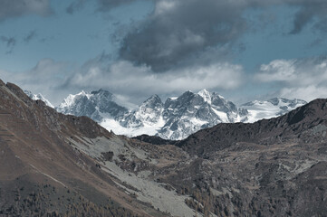 Alpine landscape compresses snowfall in autumn
