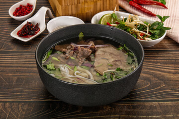 Vietnamese Pho Bo soup with beef and noodles