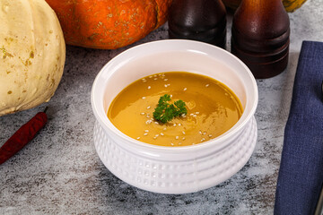 Vegan pumpkin cream soup served sesam