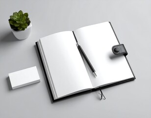 Blank open notebook with a pen and business card on a desk, ready for work and ideas